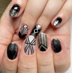 Art Deco Style created by Bekki Woolnough, Art Deco style handpainted. Styled in Chrome nail art representing Geometric. These Medium - Oval shaped nails are crafted using the Gel Polish system and are coloured Black.
