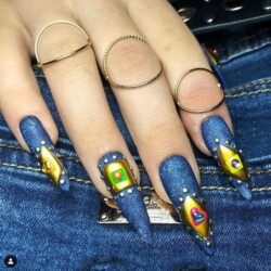 Cheeky Jeans created by Tracey Lee, Denim print with 3D and embossed elements, finished with handpainting and rhinestones.. Styled in Mixed Media nail art representing Comic / Cartoon. These Long - Stiletto shaped nails are crafted using the Press On system and are coloured Multi.