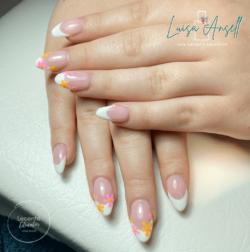 Festival Nails created by Luisa Ansell, Sculpted acrylic enhancements with a festival twist on a classic French design. Styled in French nail art representing Floral. These Medium - Almond shaped nails are crafted using the Acrylic system and are coloured Other.