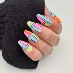 Fine Lines created by Froukje Groenendijk, Sharp lines are never easy to create. Make sure to use a good brush and have sufficient support.. Styled in Flat nail art representing Geometric. These Medium - Oval shaped nails are crafted using the Press On system and are coloured Multi.