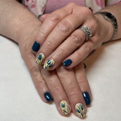 Hand Painted Tulips created by Holly Schippers, Hand painted tulip design with a watercolor effect. Styled in Flat nail art representing Floral. These Short - Squoval shaped nails are crafted using the Gel Polish system and are coloured Multi.