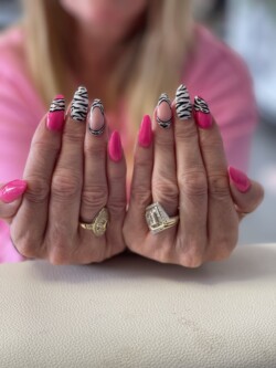 Pink Zebra created by Louise Beattie, Bright and beautiful . Styled in Flat nail art representing Animal Print. These Medium - Oval shaped nails are crafted using the Acrylic system and are coloured Pink.