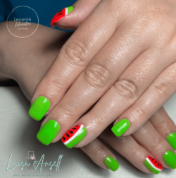 Watermelon Brights created by Luisa Ansell, Acrylic sculpted enhancements finished with a hand painted, fun watermelon design in gel polish . Styled in Hand painted nail art representing Holiday. These Medium - Square shaped nails are crafted using the Acrylic system and are coloured Green.