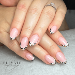 Leopard French  created by Emma Brandreth, French with hand painted leopard print and glitter gel . Styled in Flat nail art representing Animal Print. These Short - Almond shaped nails are crafted using the Fibreglass system and are coloured Multi.