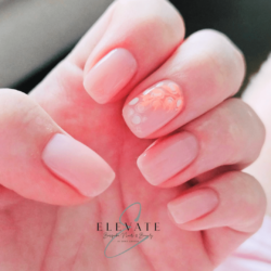 Neutral with a pop of art created by Emma Brandreth, Fibre gel nai overlay with blooming circles and orange leaves. Styled in Flat nail art representing Nature / Scenery. These Short - Squoval shaped nails are crafted using the Fibreglass system and are coloured Other.