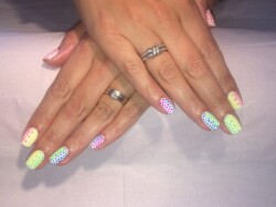 Brights Dot Graduation  created by Natalie Morris.Styled in  nail art representing Geometric. These Medium - Square shaped nails are crafted using the Gel Polish system and are coloured White. 