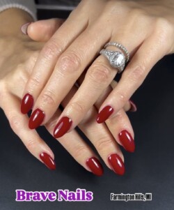 Russian mani + structure gel overlay  created by Jill DeVol.Styled in  nail art representing Minimalistic. These Medium - Almond shaped nails are crafted using the Builder system and are coloured Red. 