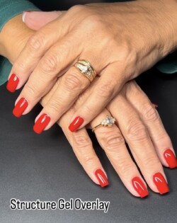 Russian Mani, IBX, structural overlay created by Jill DeVol.Styled in  nail art representing Minimalistic. These Medium - Square shaped nails are crafted using the Builder system and are coloured Red. 