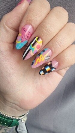 90s baby created by Jody Mackay.Styled in Mixed Media nail art representing Vintage. These Medium - Almond shaped nails are crafted using the Gel Polish system and are coloured Multi. 